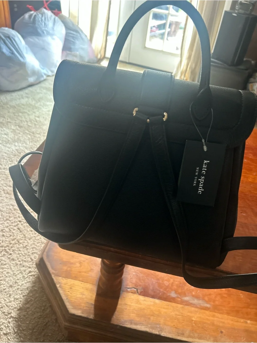 kate spade Black Pebbled Leather Messenger Bag with Gold Plaque